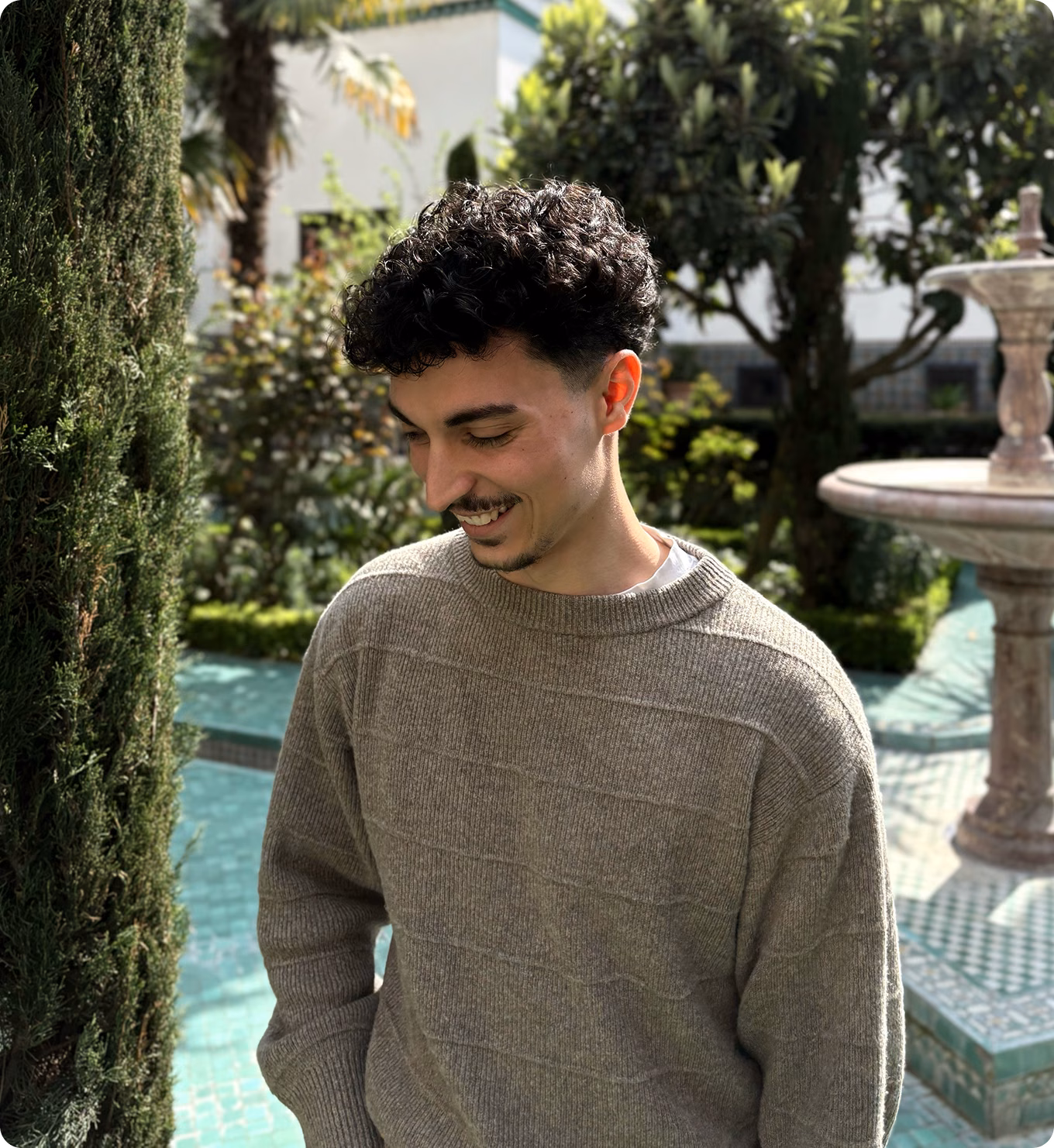 Rayane Hammoud outdoors by a fountain